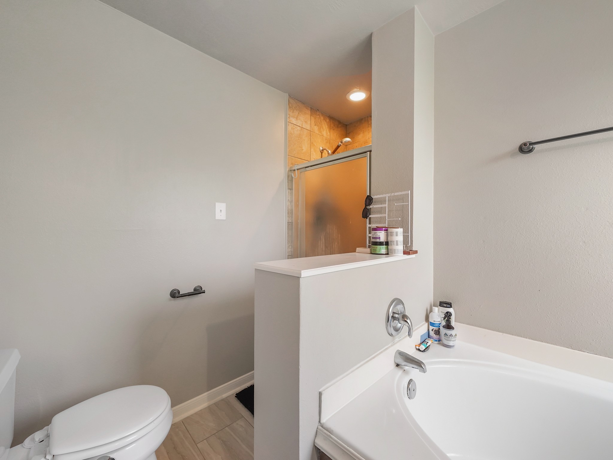 4006 Raspberry Court Dickinson, TX 77539 - Photo 17 of 22 a bathroom with a sink and mirror with toilet