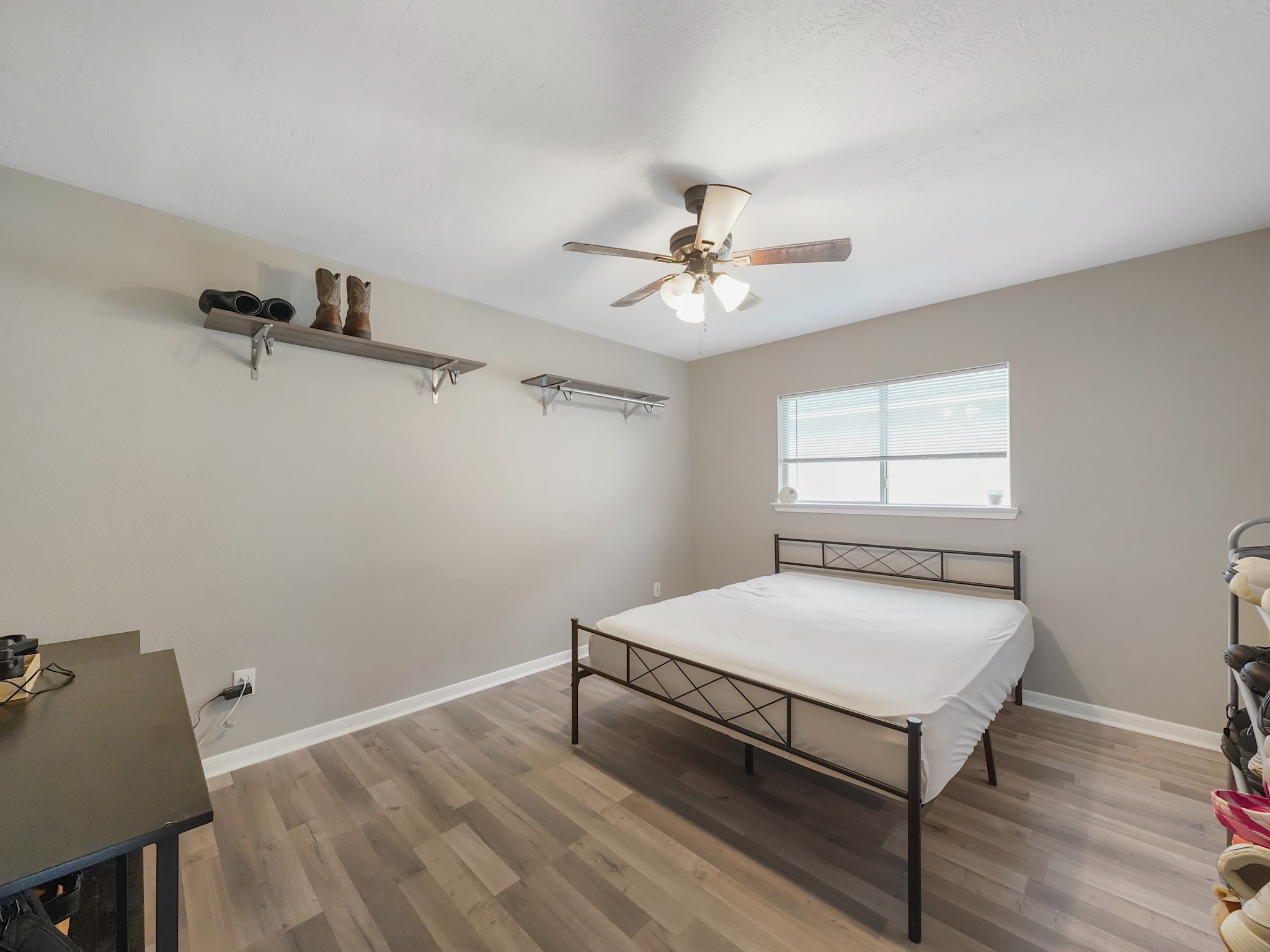 4006 Raspberry Court Dickinson, TX 77539 - Photo 18 of 22 a bedroom with a bed and a window