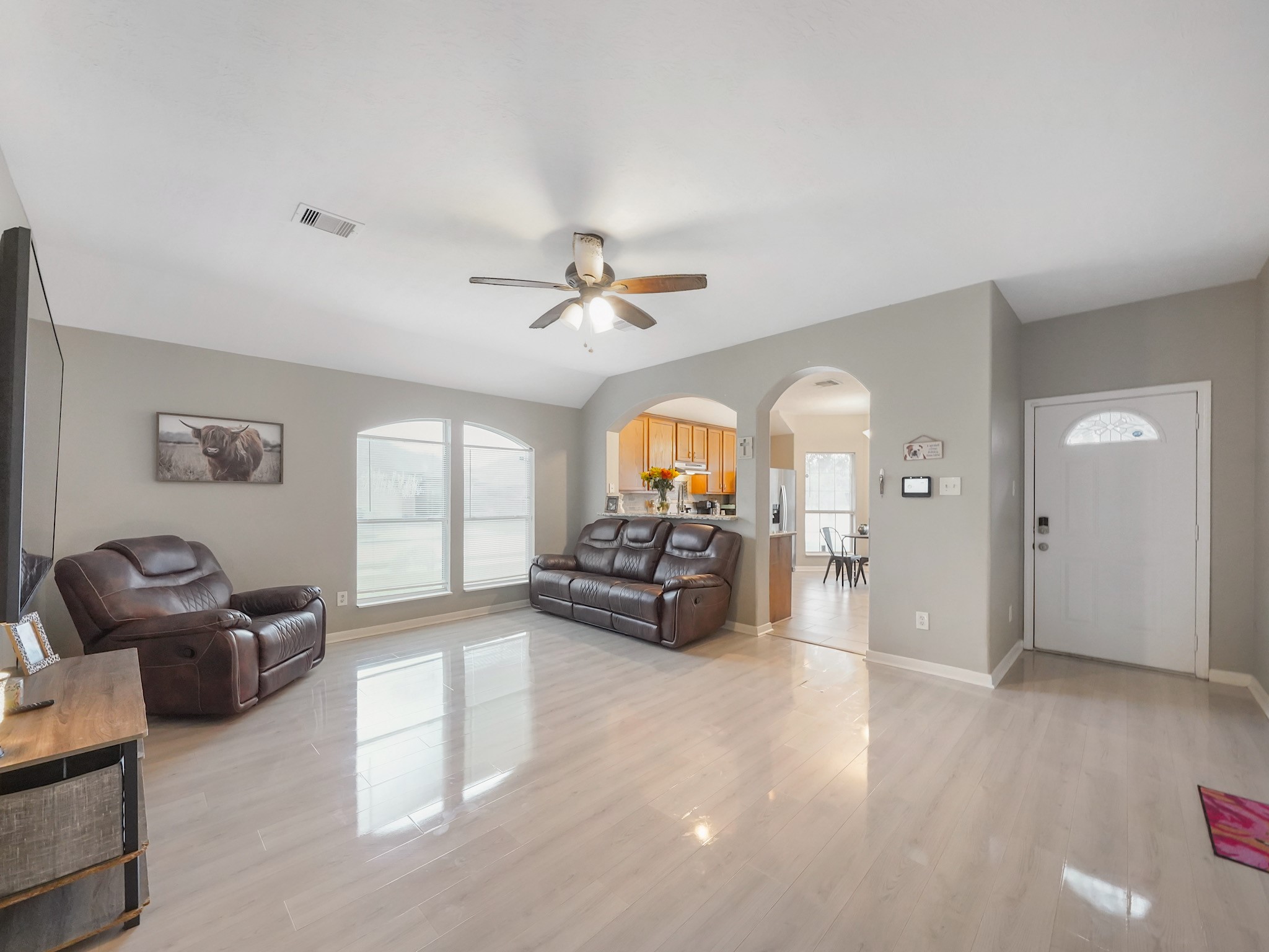4006 Raspberry Court Dickinson, TX 77539 - Photo 9 of 22 a view of a livingroom with furniture hardwood floor and a ceiling fan