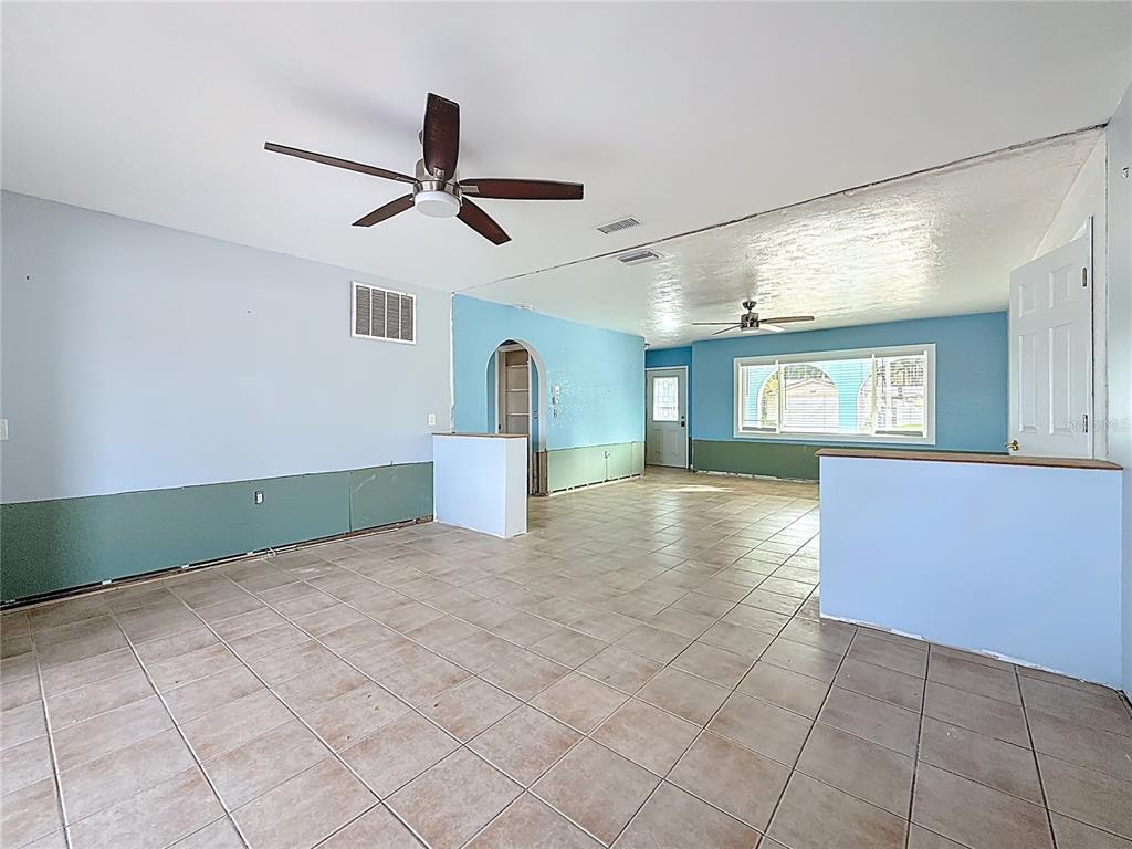 4869 Shell Stream Boulevard New Port Richey, FL 34652 - Photo 18 of 46 a view of empty room with wooden floor and fan