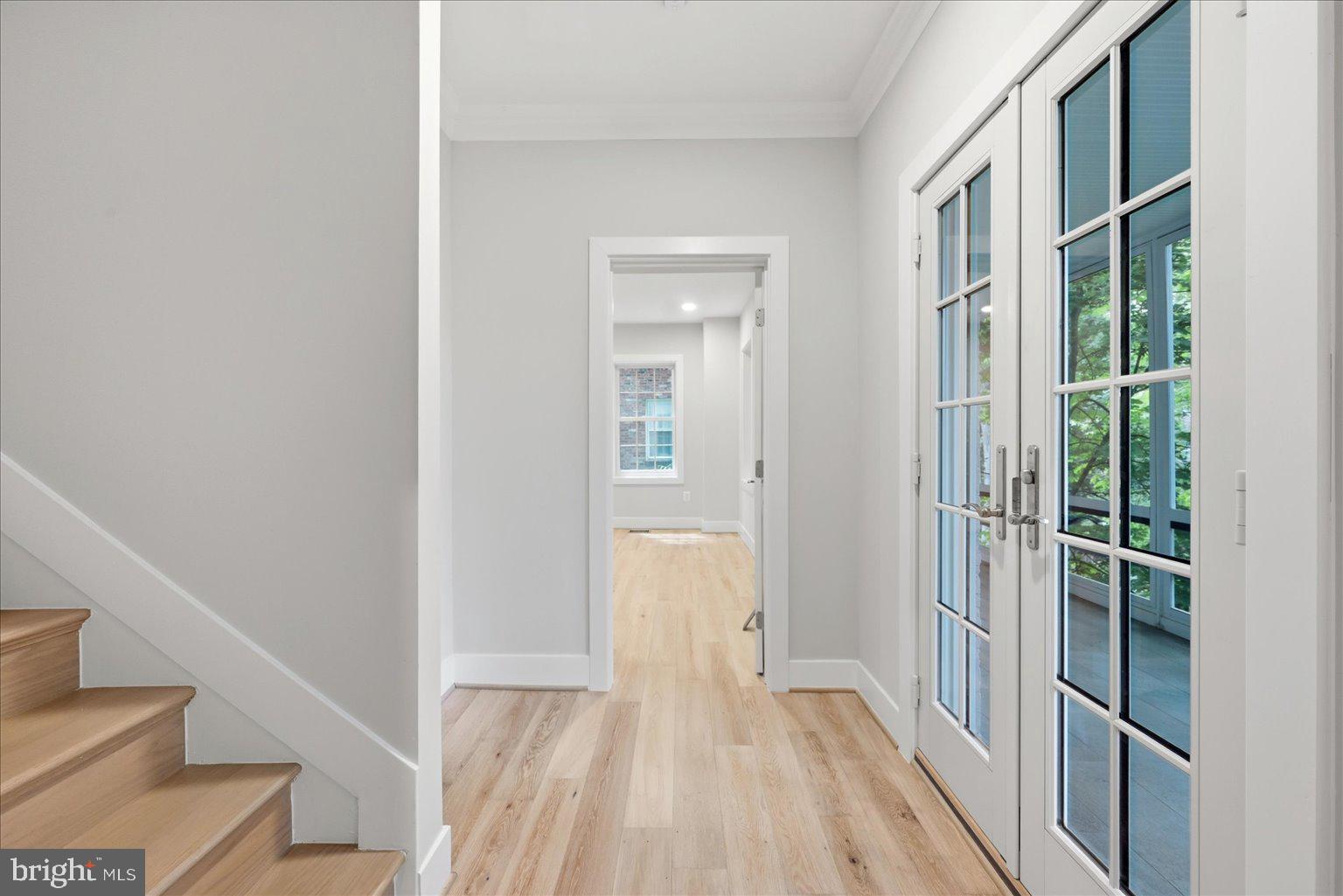 3517 Rodman Street Northwest Washington, DC 20008 - Photo 41 of 57 a view of a hallway with wooden floor and entryway