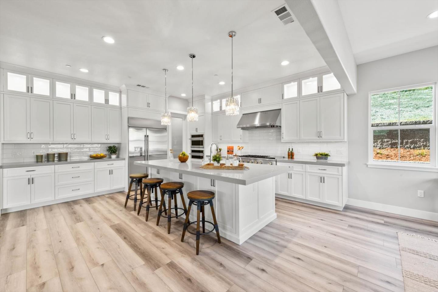 9515 Faria Preserve Parkway San Ramon, CA 94583 - Photo 19 of 84 a kitchen with white cabinets and white appliances
