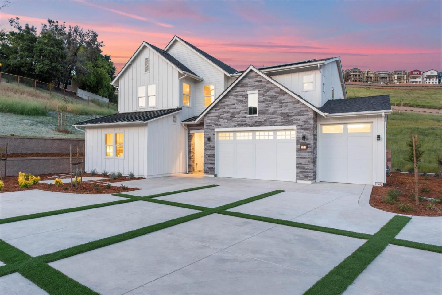 9515 Faria Preserve Parkway San Ramon, CA 94583 - Photo 2 of 84 a front view of a house with a yard and garage