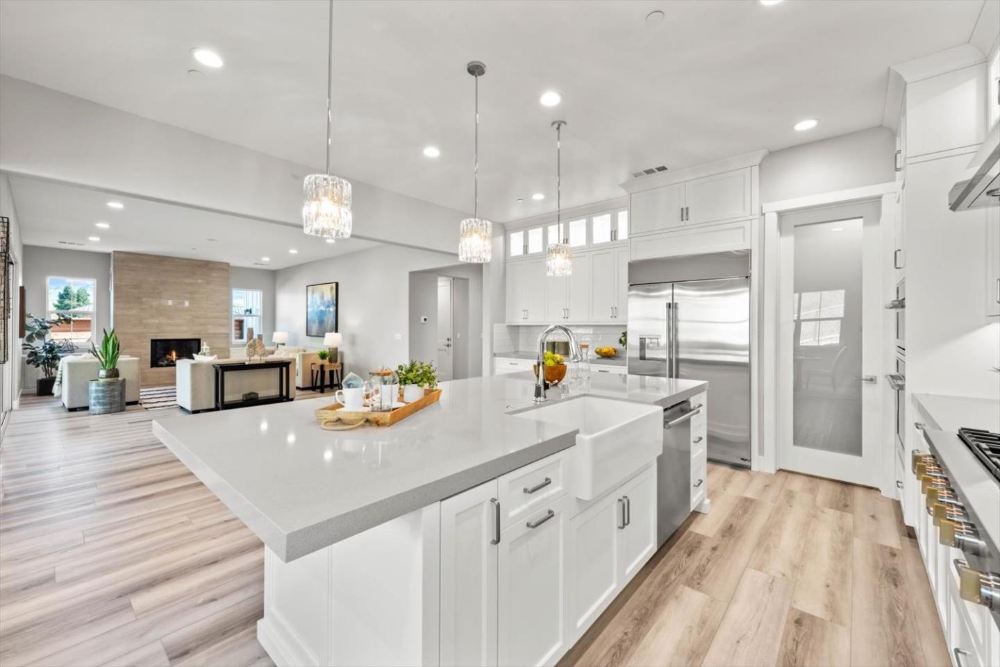 9515 Faria Preserve Parkway San Ramon, CA 94583 - Photo 22 of 84 a large white kitchen with lots of counter space wooden floor and appliances