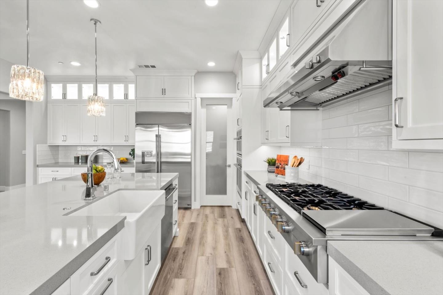 9515 Faria Preserve Parkway San Ramon, CA 94583 - Photo 26 of 84 a kitchen with a stove a sink a refrigerator and cabinets