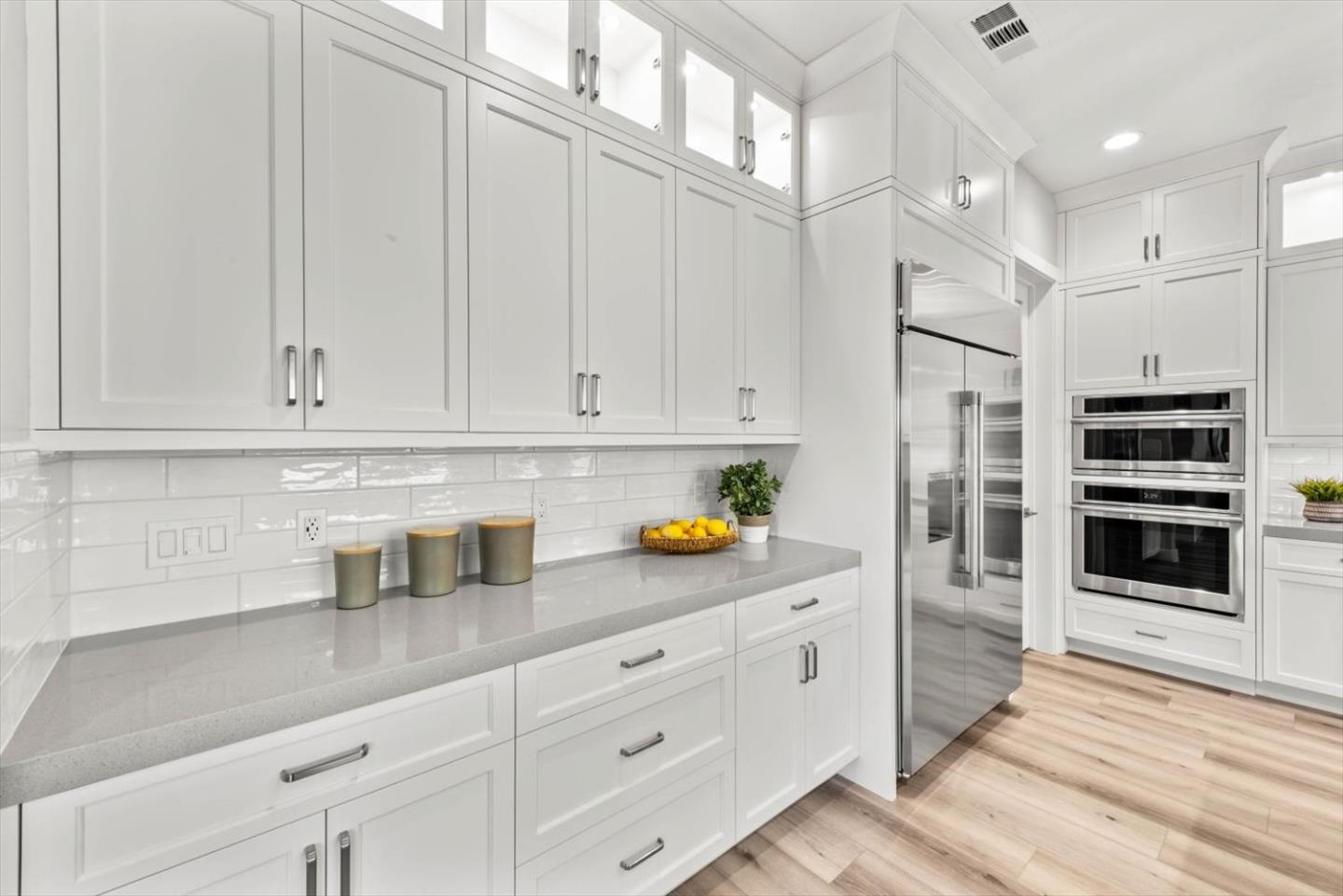 9515 Faria Preserve Parkway San Ramon, CA 94583 - Photo 27 of 84 a kitchen with stainless steel appliances white cabinets and a sink