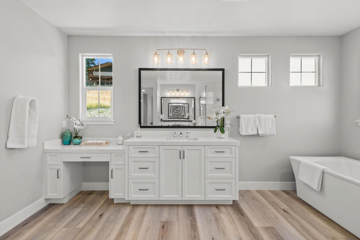 9515 Faria Preserve Parkway San Ramon, CA 94583 - Photo 59 of 84 a spacious bathroom with a double vanity sink a mirror and a bathtub