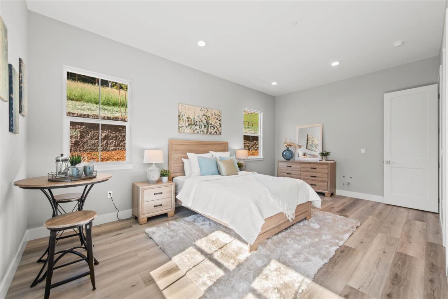 9515 Faria Preserve Parkway San Ramon, CA 94583 - Photo 64 of 84 a spacious bedroom with a bed and wooden floor