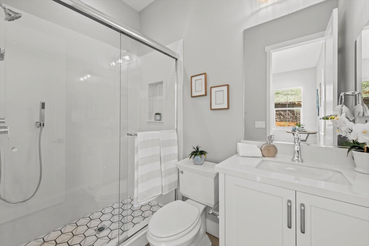 9515 Faria Preserve Parkway San Ramon, CA 94583 - Photo 66 of 84 a bathroom with a sink a toilet and shower