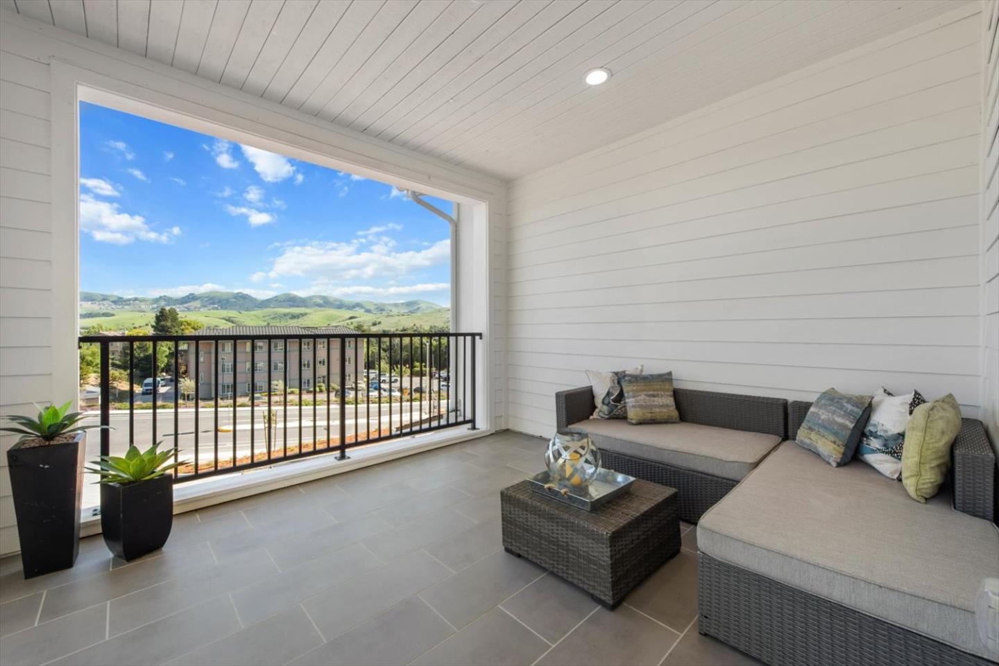 9515 Faria Preserve Parkway San Ramon, CA 94583 - Photo 68 of 84 a living room with furniture and a floor to ceiling window