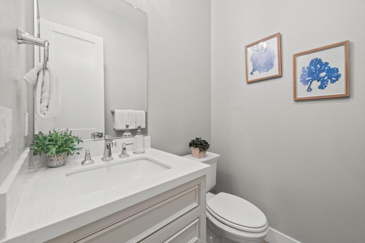 9515 Faria Preserve Parkway San Ramon, CA 94583 - Photo 8 of 84 a bathroom with a sink mirror and toilet