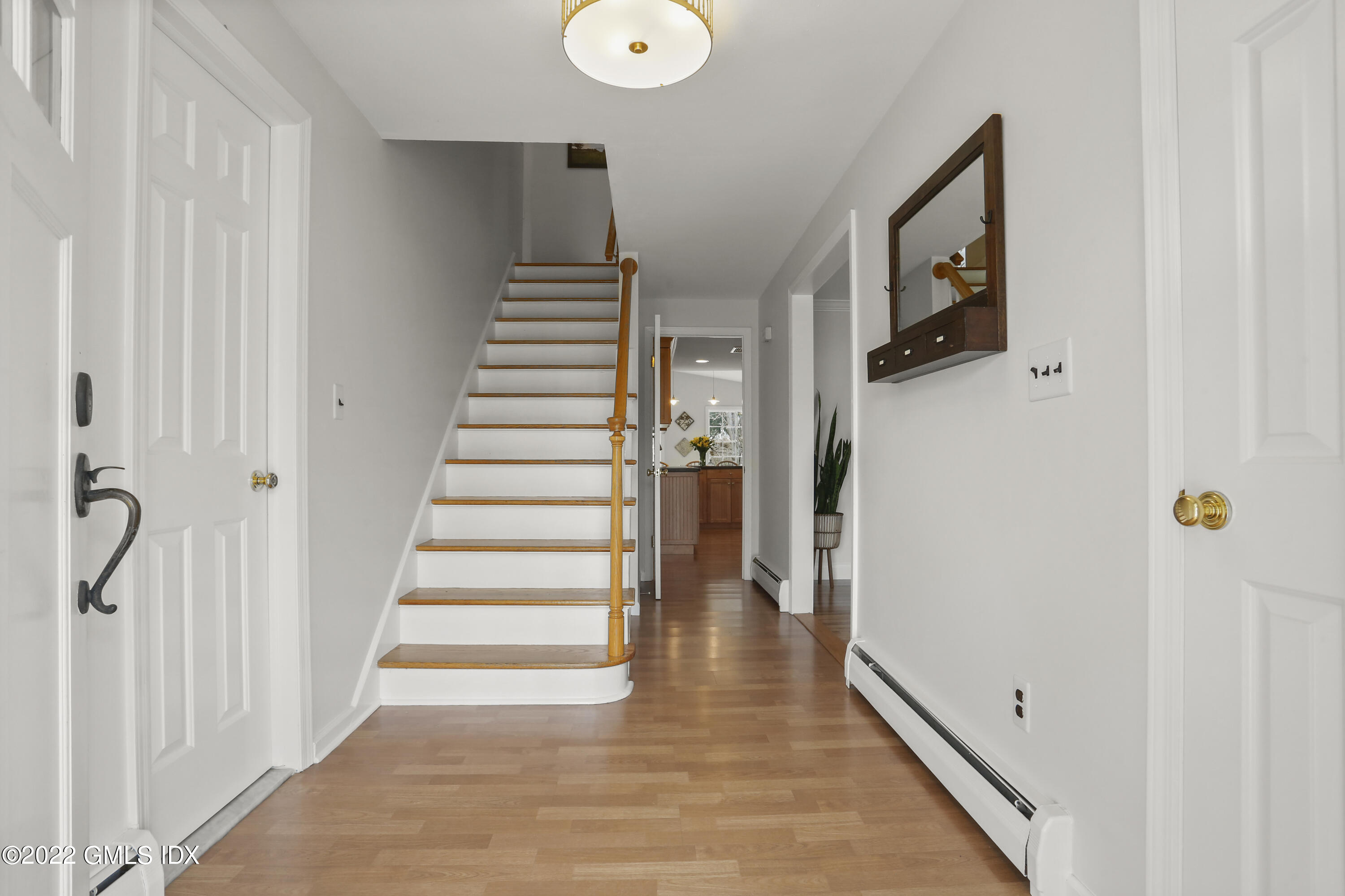 33 Revere Road Riverside, CT 06878 - Photo 3 of 32 a view of a hallway with wooden floor and staircase