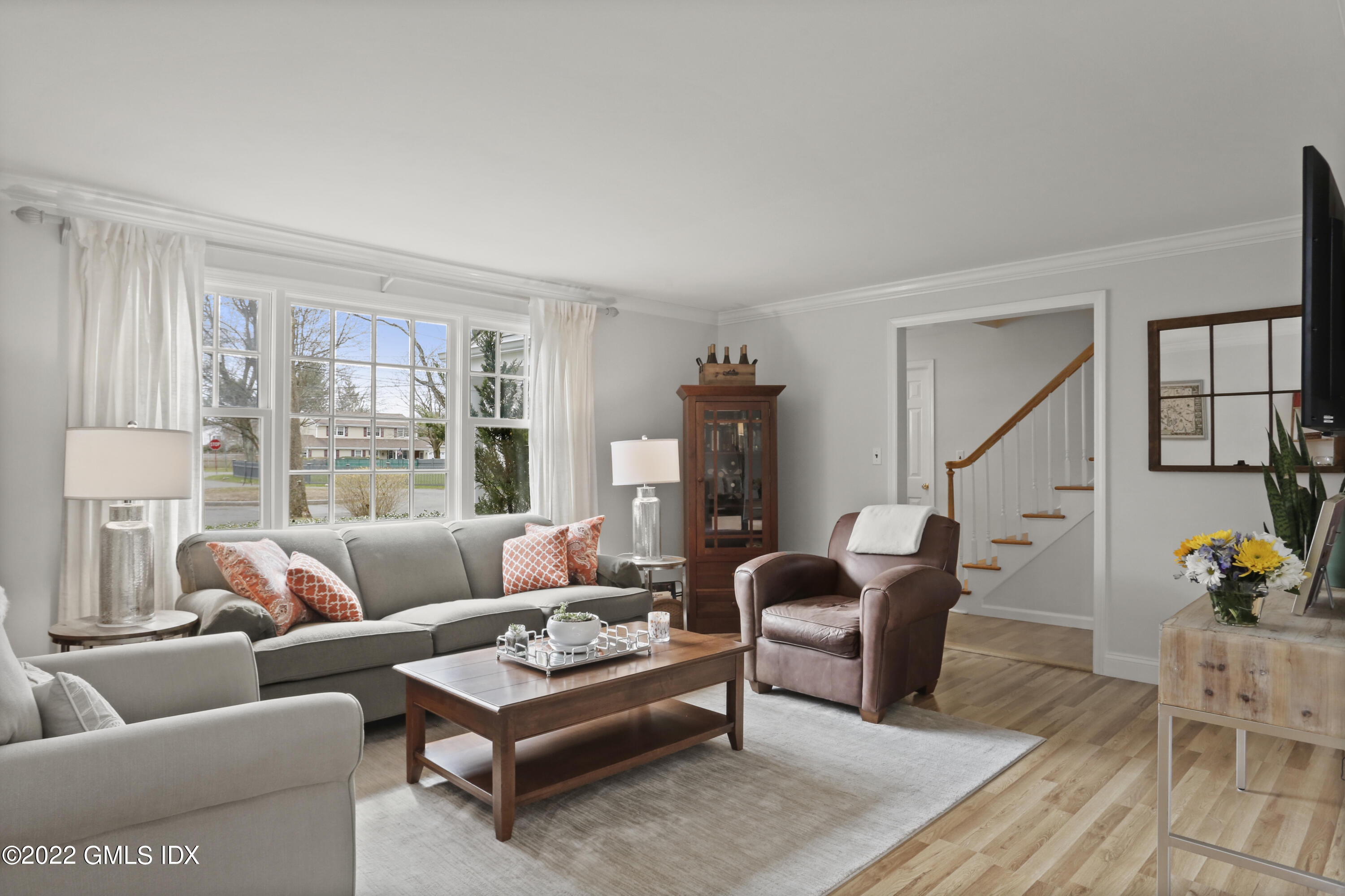 33 Revere Road Riverside, CT 06878 - Photo 4 of 32 a living room with furniture a rug and a large window