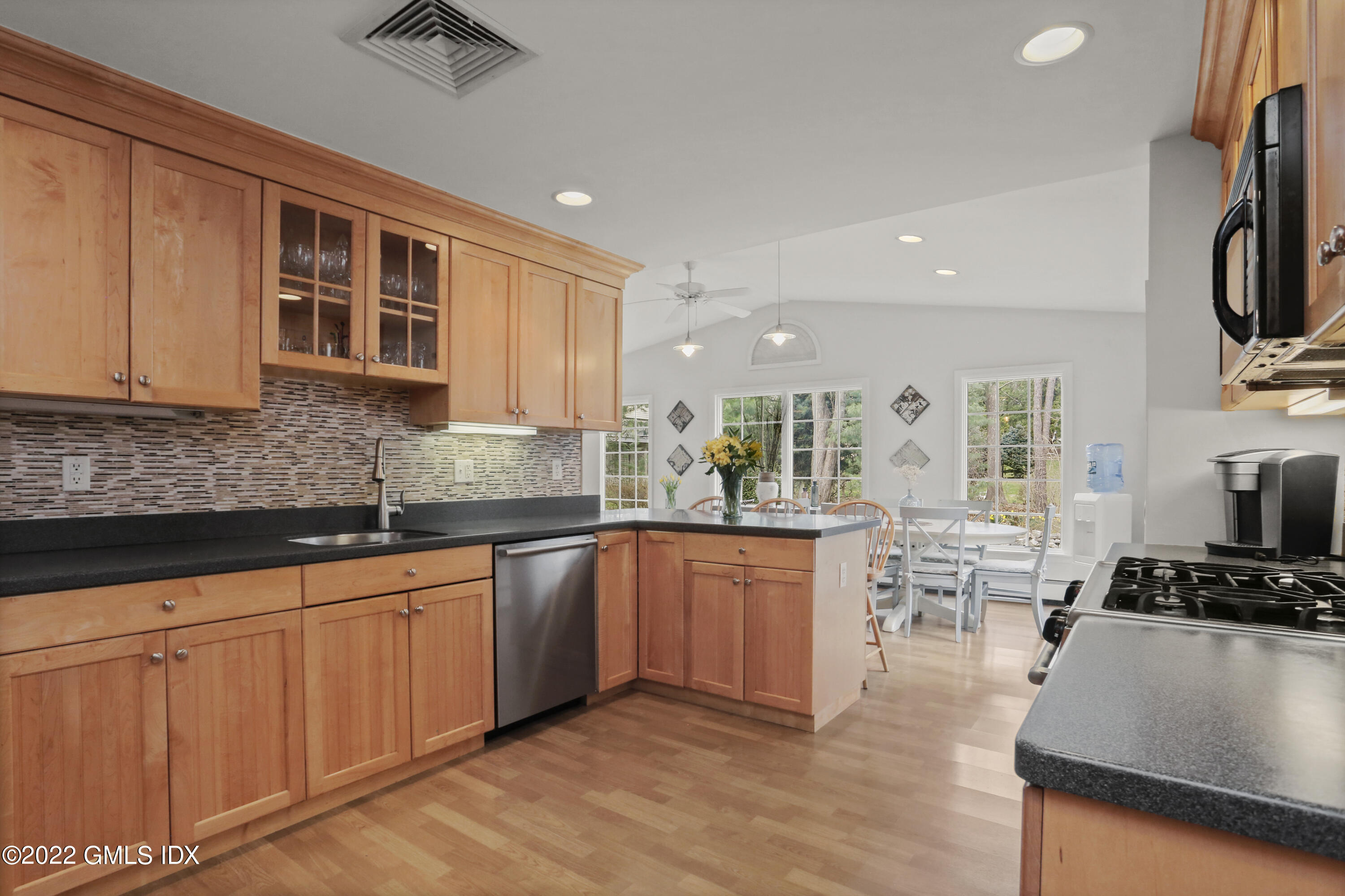 33 Revere Road Riverside, CT 06878 - Photo 9 of 32 a kitchen with cabinets a sink and appliances
