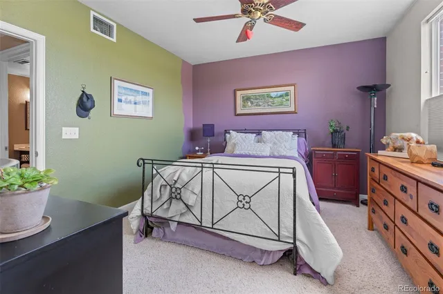 a bedroom with a bed and a table