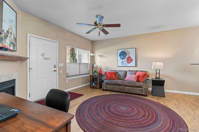 a living room with furniture and a rug