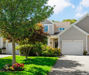 a front view of house with garden