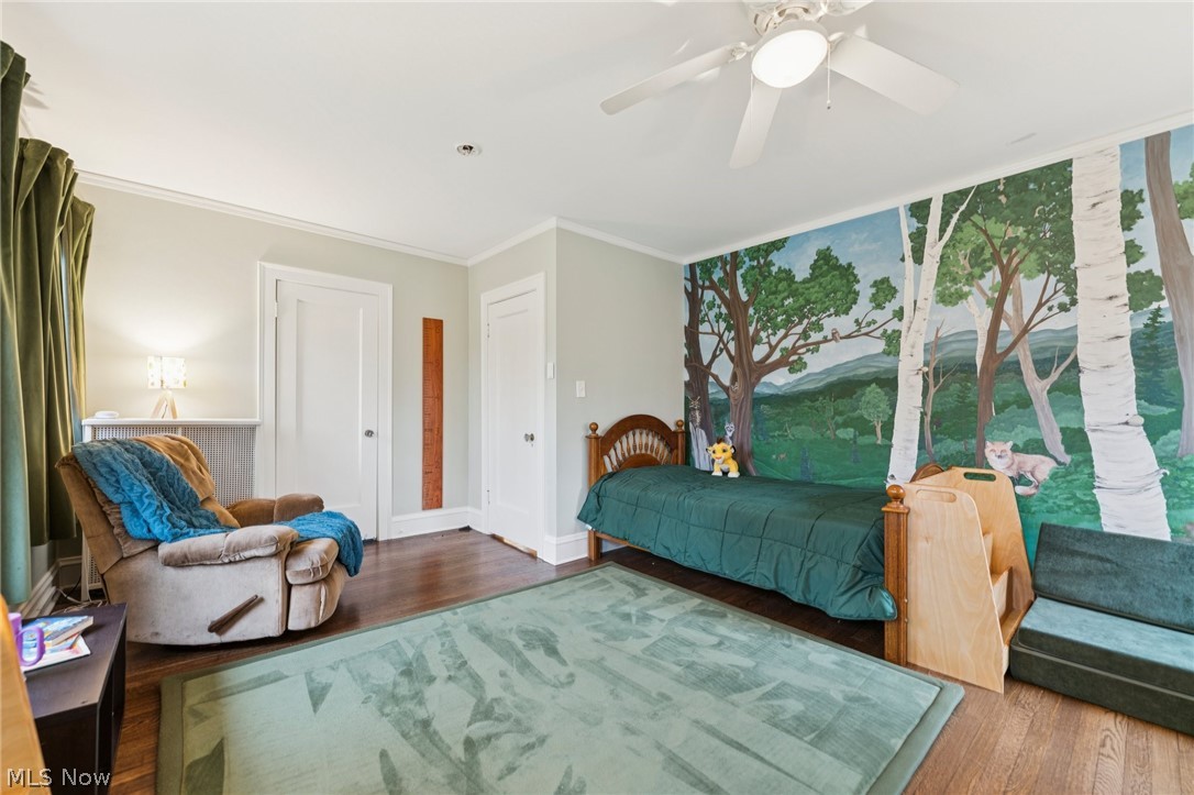 2925 East Overlook Road Cleveland Heights, OH 44118 - Photo 25 of 48 This room features hardwood floors, a ceiling fan, and a painted mural on one wall