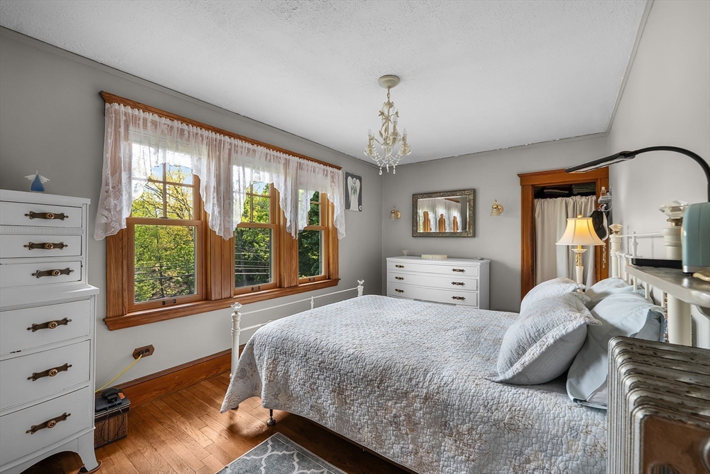 296 North Main Street Cohasset, MA 02025 - Photo 12 of 27 a bedroom with a large bed and a window