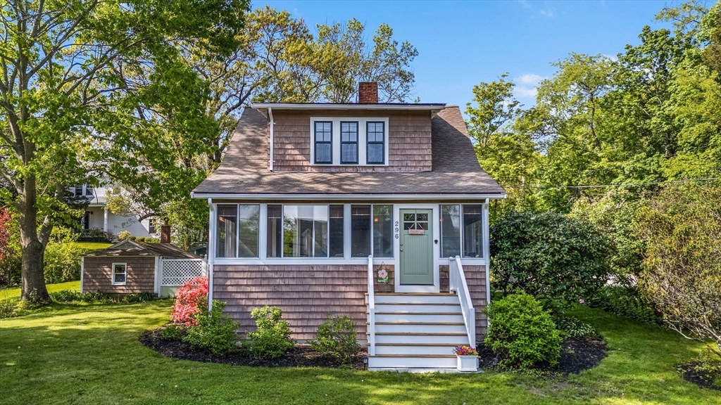 296 North Main Street Cohasset, MA 02025 - Photo 20 of 27 a front view of a house with a yard