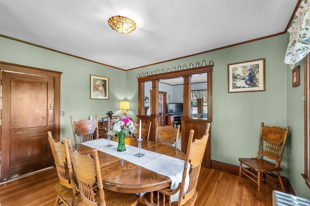 296 North Main Street Cohasset, MA 02025 - Photo 6 of 27 a view of a dining room with furniture a chandelier and wooden floor