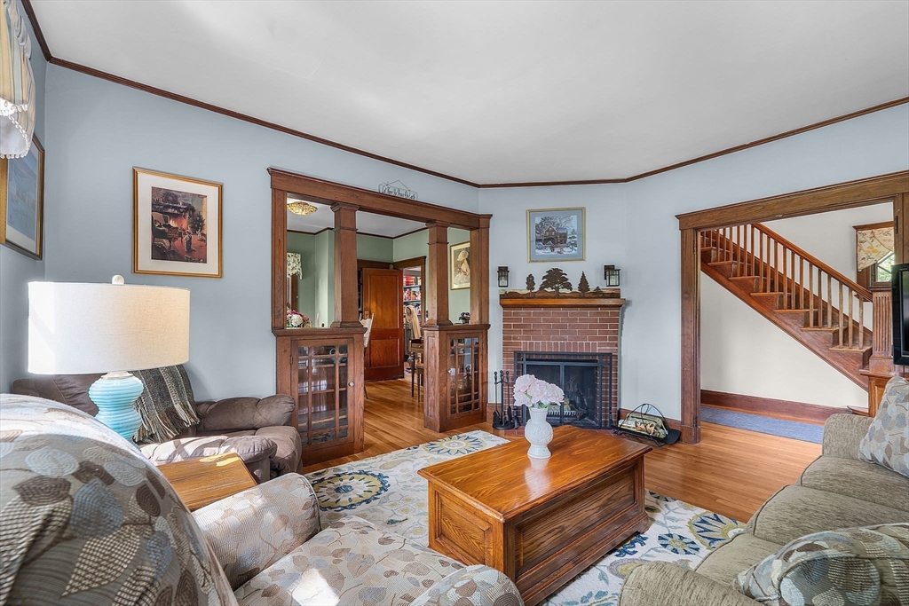 296 North Main Street Cohasset, MA 02025 - Photo 8 of 27 a living room with furniture and a fireplace
