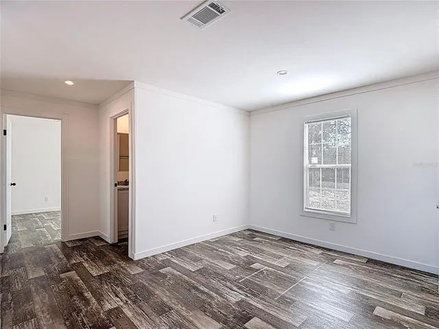 a view of an empty room and window