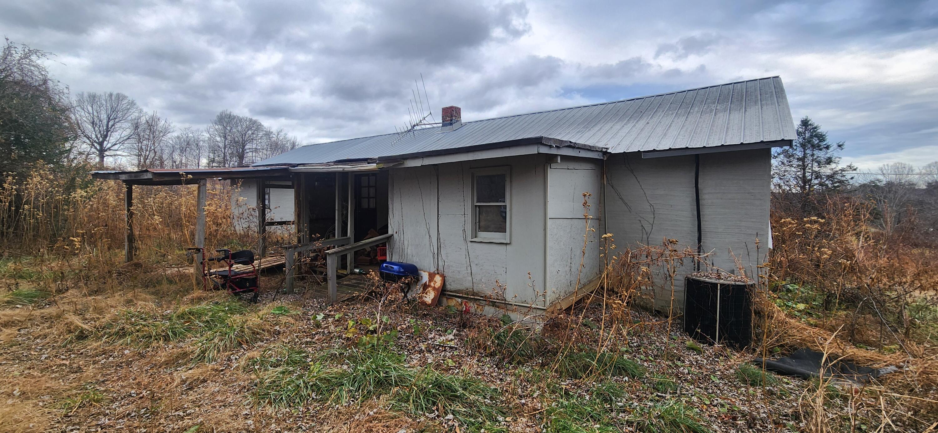 10401 Callaway Road Callaway, VA 24067 - Photo 2 of 14 a backyard of a house with table and chairs