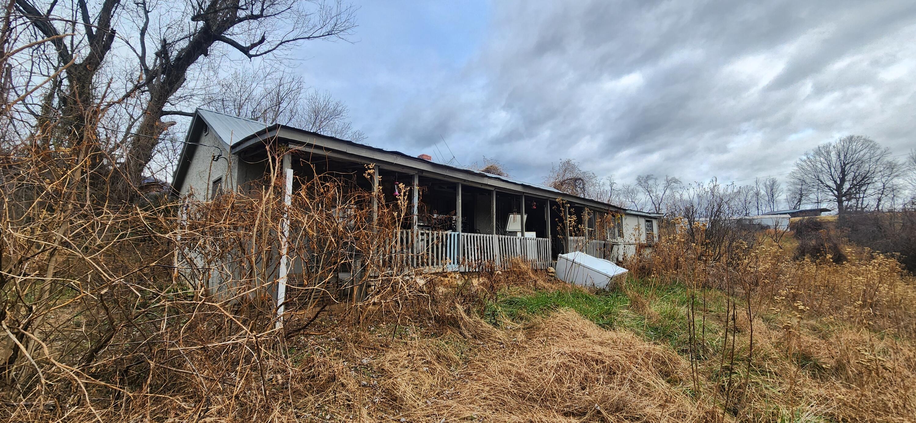 10401 Callaway Road Callaway, VA 24067 - Photo 3 of 14 a backyard of a house with lots of green space