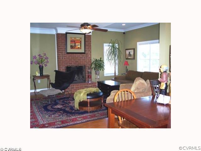 2750 Leatherwood Road Maidens, VA 23102 - Photo 4 of 8 a living room with furniture and a fireplace