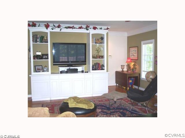 2750 Leatherwood Road Maidens, VA 23102 - Photo 5 of 8 a living room with furniture and a fireplace