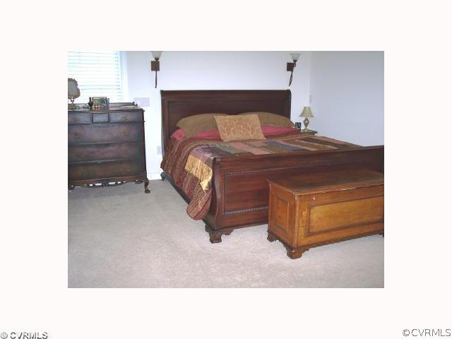 2750 Leatherwood Road Maidens, VA 23102 - Photo 6 of 8 a bedroom with a bed and a mirror