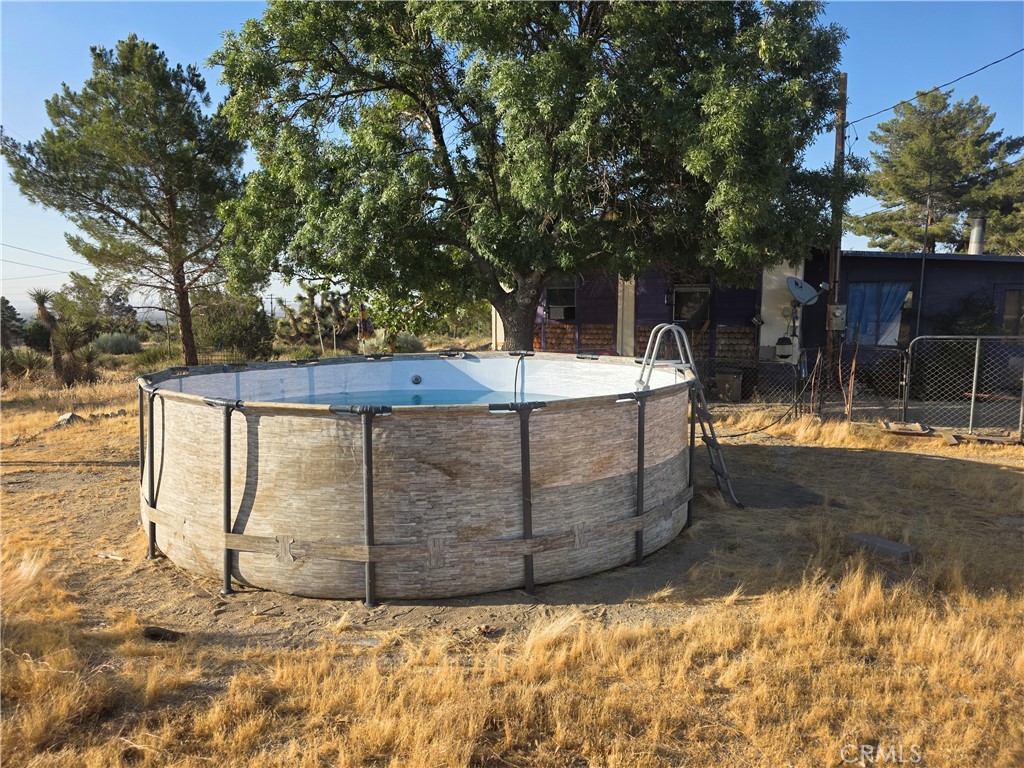 10623 Desert View Road Pinon Hills, CA 92372 - Photo 51 of 76 a view of a backyard of the house