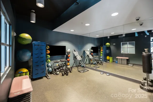 a view of a livingroom with furniture and a flat screen tv