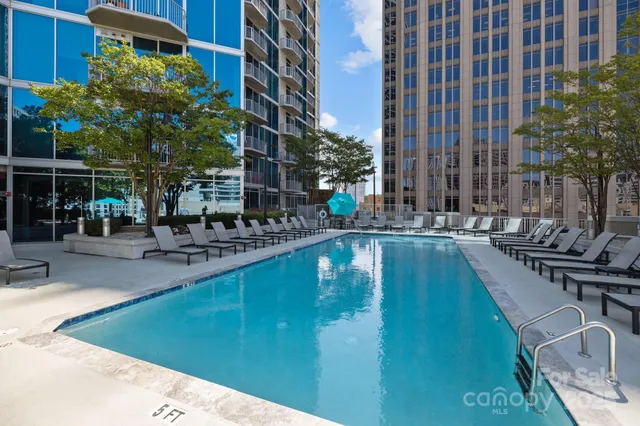 a large white kitchen with lots of counter space and appliances