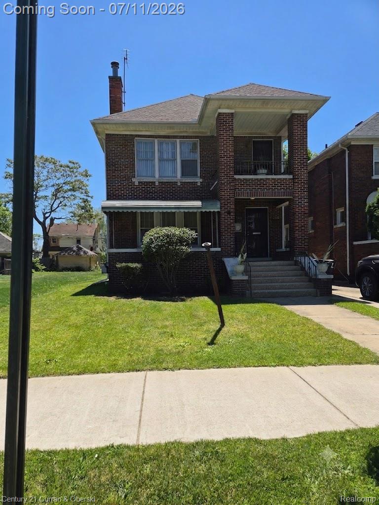 3237 Calvert Avenue Detroit, MI 48206 - Photo 1 of 8 Brick exterior residence featuring a front lawn and paved walkway