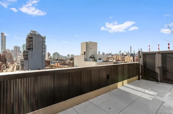 a terrace with a city view