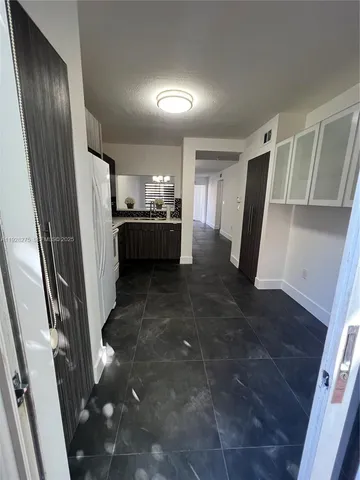 a view of entryway with kitchen