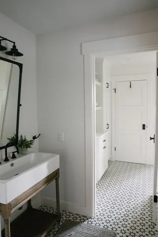 a bathroom with a sink and a mirror