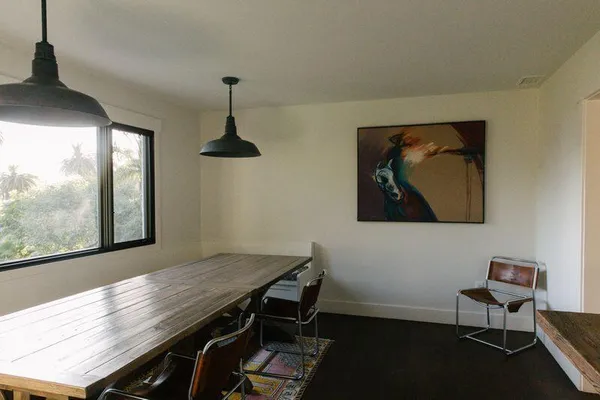 a view of living room with patio furniture and garden