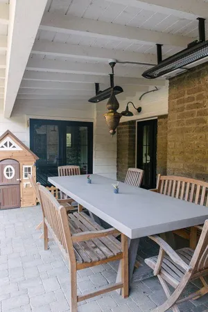 a view of a two chairs in the balcony