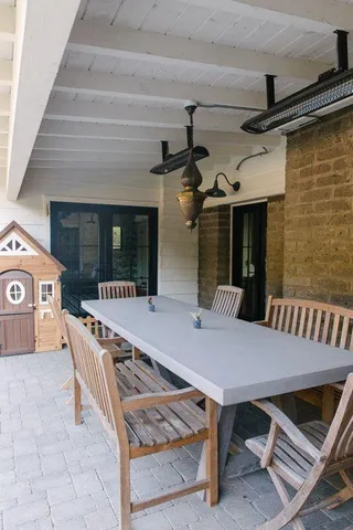 a view of a two chairs in the balcony