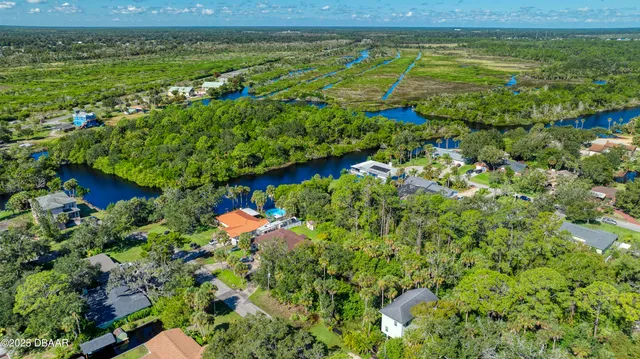an aerial view of a houses with outdoor space