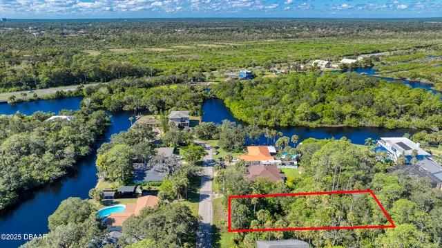 an aerial view of a houses with outdoor space