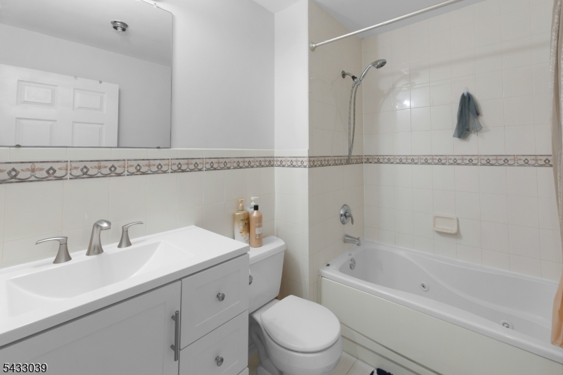 158 Autumn Ridge Road Morris Plains, NJ 07950 - Photo 11 of 26 a bathroom with a sink a toilet and shower
