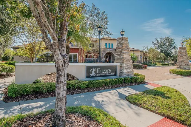 a sign board with a park park in front of the house