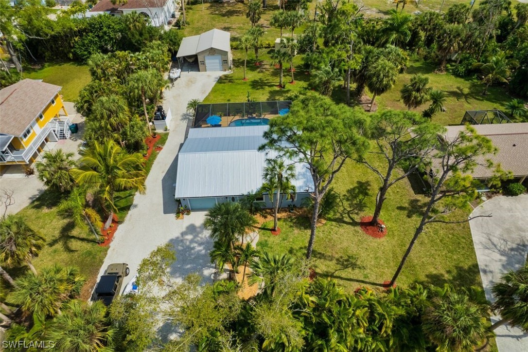 an aerial view of residential house with an outdoor space