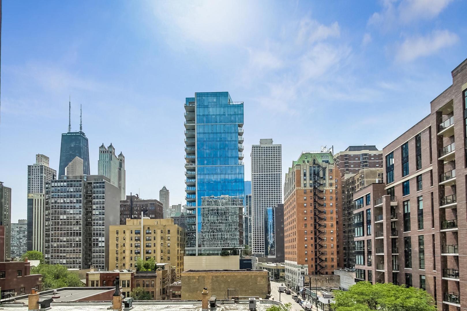 1 East Scott Street, Unit 709 Chicago, IL 60610 - Photo 14 of 31 a city view with tall buildings