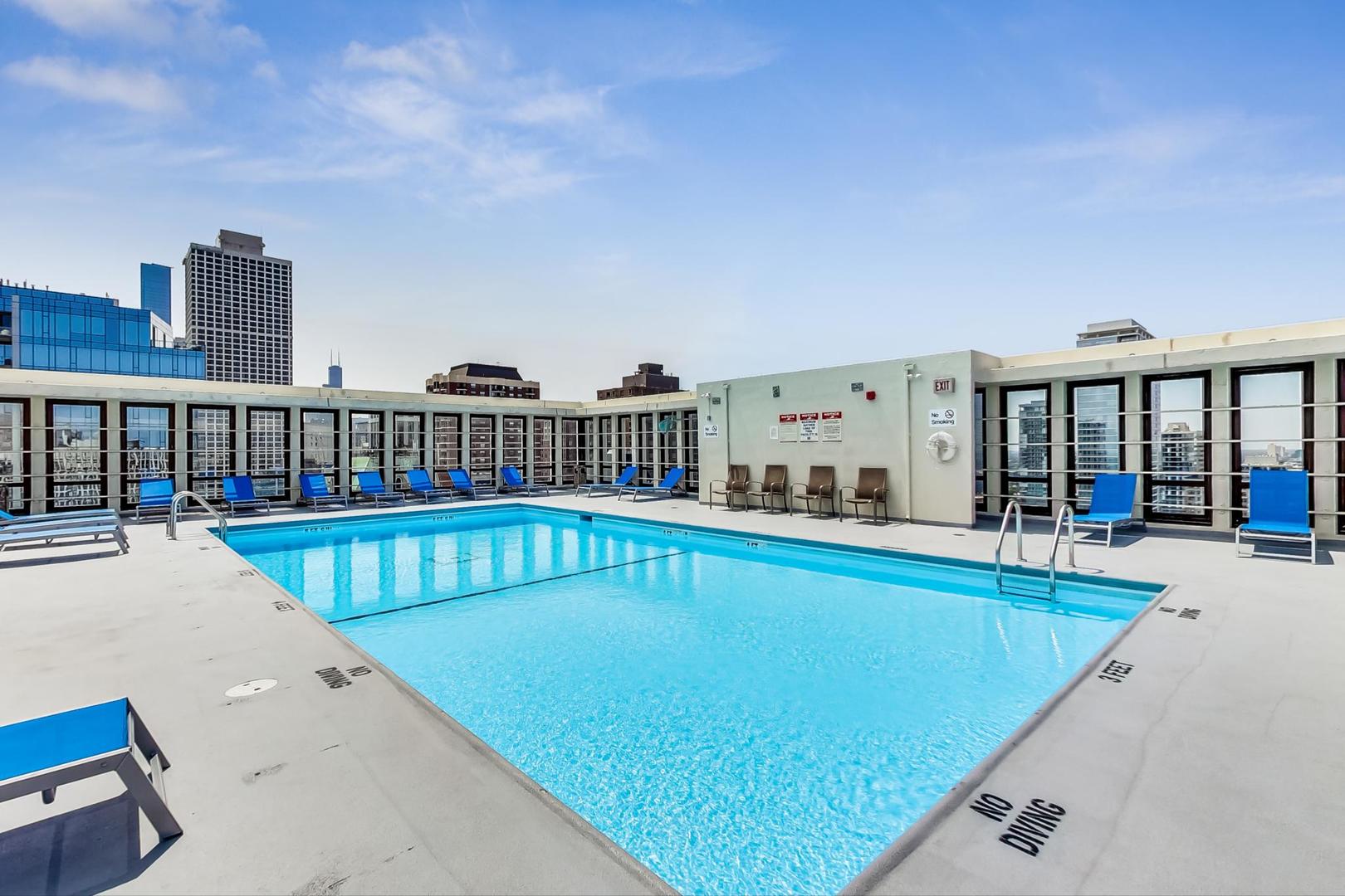1 East Scott Street, Unit 709 Chicago, IL 60610 - Photo 27 of 31 a view of a swimming pool with a lounge chair