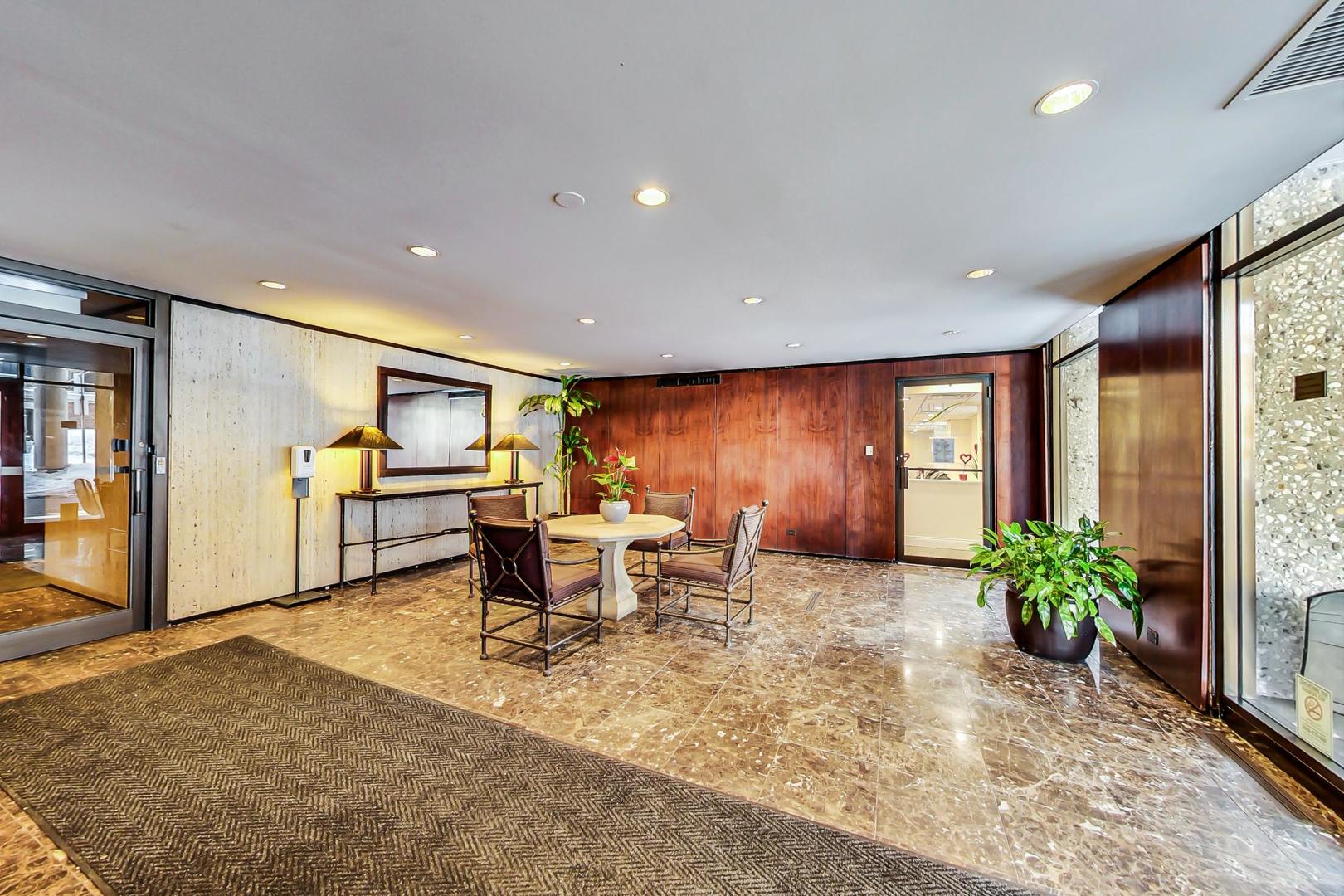 1 East Scott Street, Unit 709 Chicago, IL 60610 - Photo 6 of 31 a living room with furniture